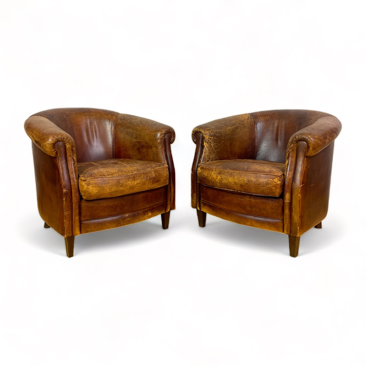 Pair of French Leather Barrel Back Club Chairs